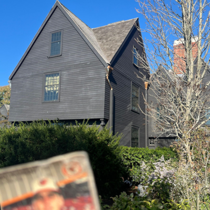 [Image: Billy Ripken card held up at the rear the House of Seven Gables in Salem.]