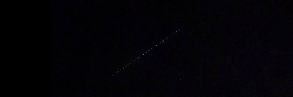 [Image: A line of more than two dozen Starlink satellites is seen being deployed overhead in the night sky. They were moving fast.]