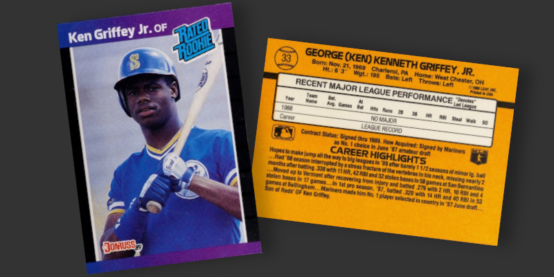 Image: Front and back of a 1989 Donruss Ken Griffey, Jr. Rated Rookie baseball card. The front has purple borders and features Griffey posing for the camera with a bat on his shoulder. The back of the card is printed against a bright orange background.